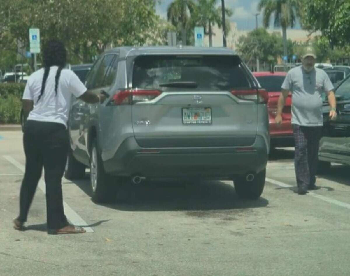 Still footage from a cellphone video shows Melissa Payne holding a gun moments before she fatally shot Bart DiGuglielmo on June 30, 2026, in a North Lauderdale Walmart parking lot.